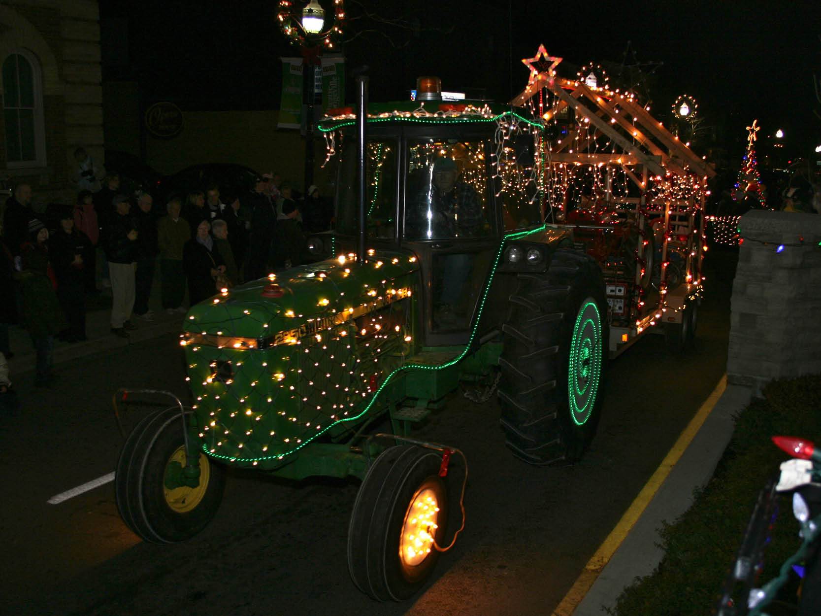 Tractor decorated in lights at night